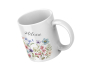 Preview: Weiße Keramiktasse mit floralem Aquarellmotiv und personalisiertem Namen „Milena“, schräg von oben fotografiert auf weißem Hintergrund.